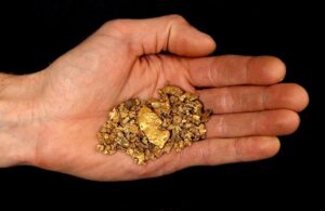 hand-full-of-gold-nuggets-53773200_Large.jpg